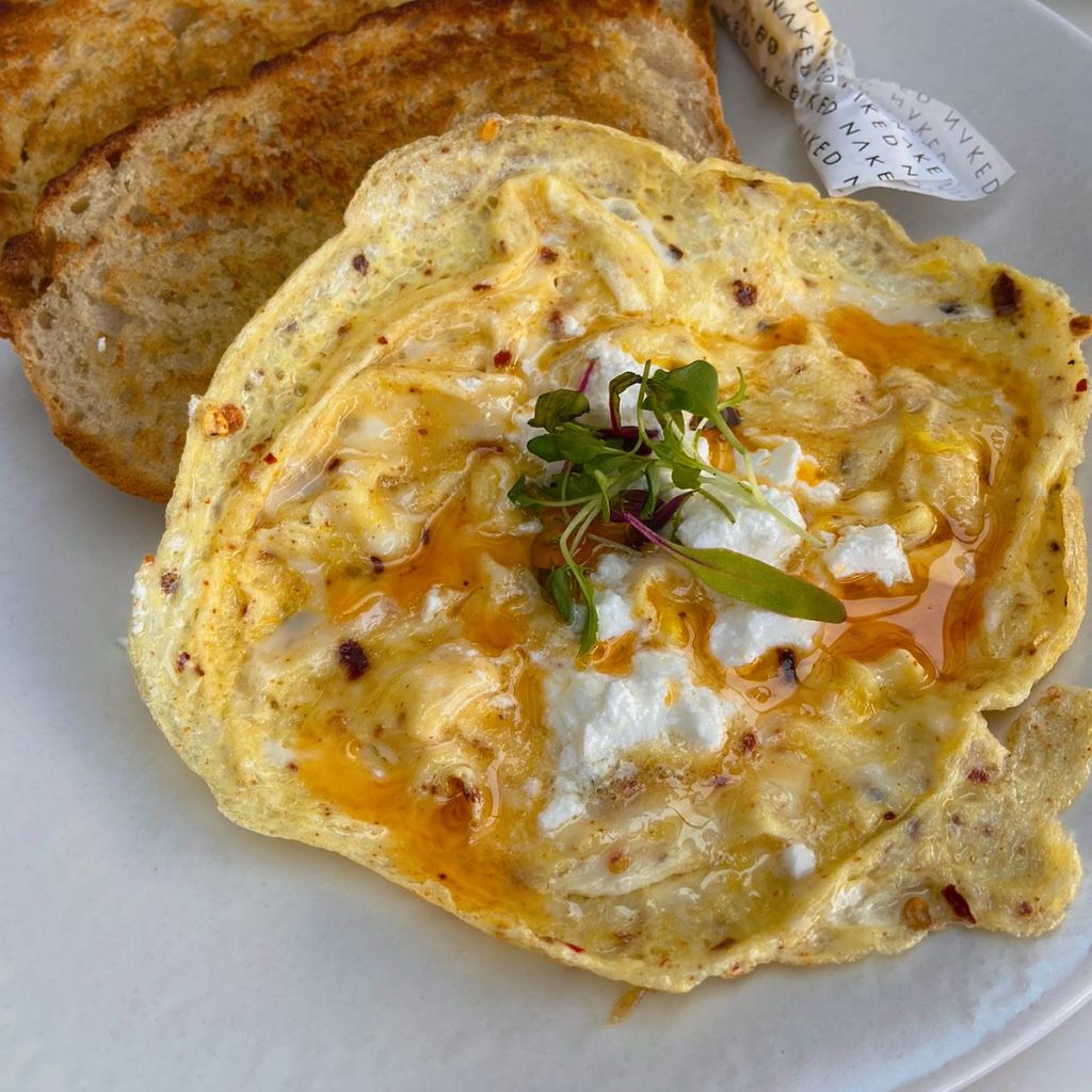 Chilli Scrambled eggs from @nakedcoffee_ . New branch in Illovo