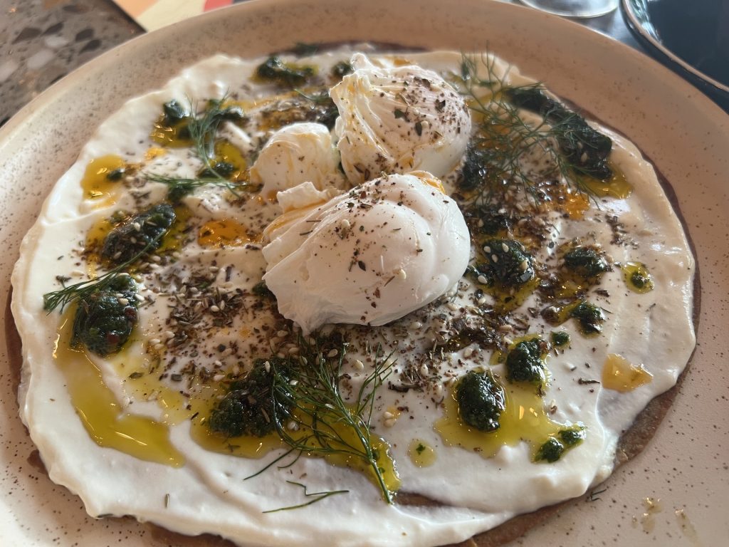 Turkish Eggs this morning at @the_proudmary in Rosebank. Poached eggs on lachha paratha, chilli chimichurri, lemon yoghurt, fresh dill, za’atar. Sublime this was#breakfast #eggs #turkisheggs #breakfastideas #rosebank #poachedeggs #earlymornings