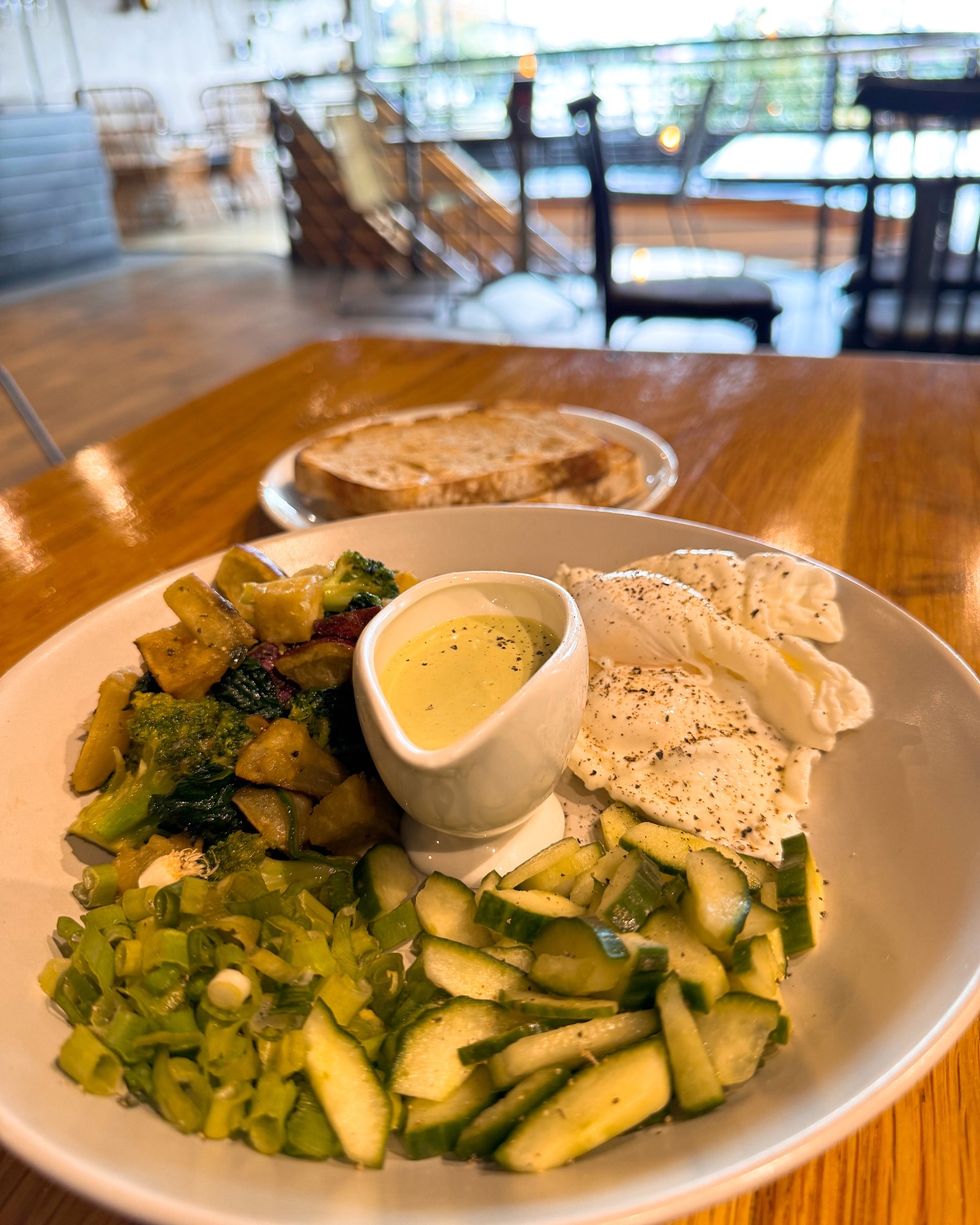 Sweet potato & Greens breakfast at @thegrindza in Melrose Arch. Two poached eggs, baby spinach, broccoli, sweet potato, cucumber and spring onion