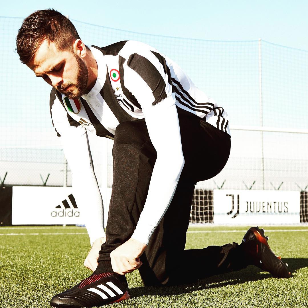 Calm before the Storm. Pjanic tries on the new Adidas Predator before the Big Clash with Barcelona tonight