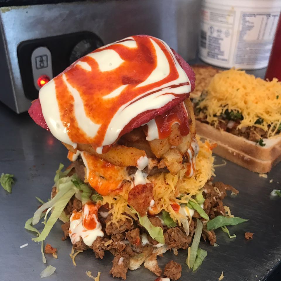 Ok so This is the Iron Man burger launched in honour of the crew led by @motalamohamed at Iron Man 2018. Its also launched in honour of our very own Ebie Ahmed @eyahmed who will biter at Iron Man 2018. Enjoy Lads 😀. If you can swim 3.8km,Bike 180km and run for 42km then You can put this away.Double Pattie,Cheese,Steak,chips,French Polony,Salads,sriracha Mayo and sauce Available at Akhals Bree Street#ironman #im2018 #ironmansa #triathlons #triathletes #pe #portelizabeth #ironmanburger #burgertime #gourmetburger #