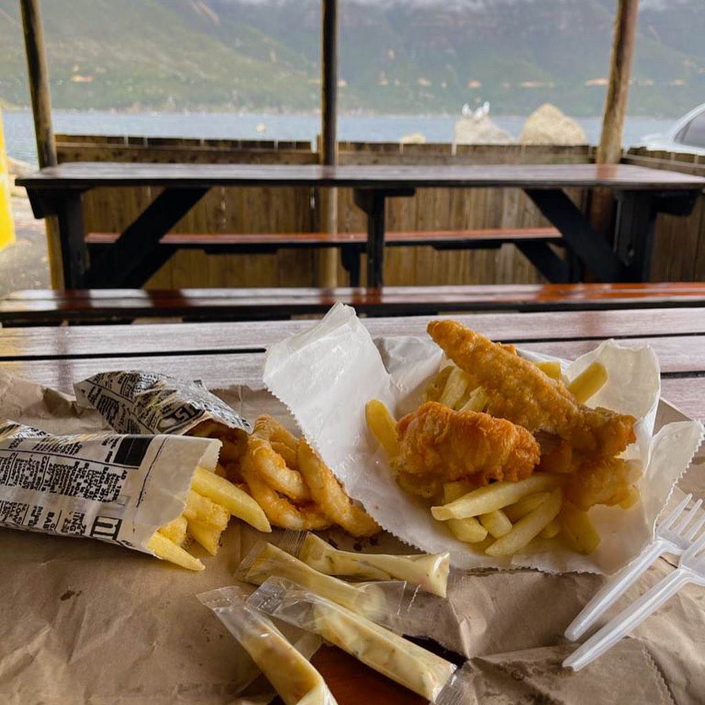 Nothing like Fresh Fish & Chips at Fish on the rocks in Hout Bay, Cape Town by @waheedvadi #fishandchips #freshfish #houtbay #capetown #fishontherocks #capetownliving #houtbayharbour #houtbaylife #calamari #seafood