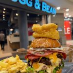 Big Daddy Burger at Mugg and Bean Killarney Mall #halaal . . Layered with Gherkins, tomato, burger mayo, red onion & lettuce. With a fried egg, Macon and cheddar. Topped with battered onion rings #burger #burgertime #bigdaddyburger