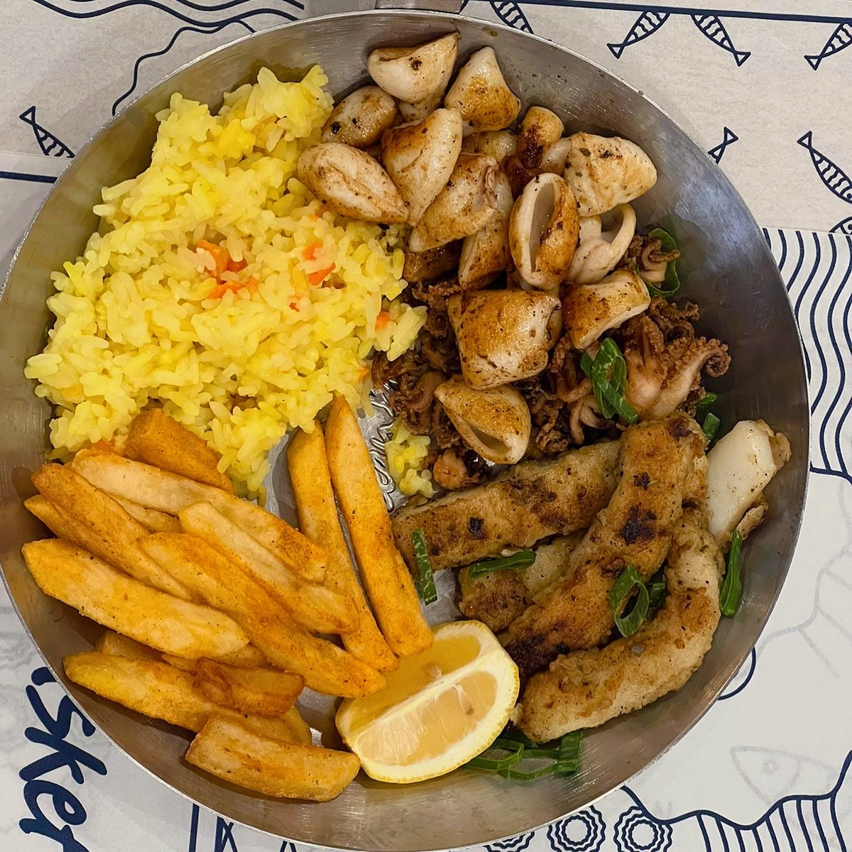 Calamari Trio with chips and rice. Tender giant squid steak strips with calamari tubes and heads at @oceanbasket_killarney #halaal#seafood #calamari #oceanbasket