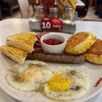 “Lekker Breakfast” at Wimpy Killarney Mall @wimpykillarney . 2 eggs, 3 slices smoked beef, beef boerewors, 2 cheese and sweet corn mealie bread flapjacks served with famous wimpy relish and toast