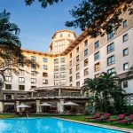 Southern Sun Dar es Salaam Reopens After Four-Year Hiatus with a Modern RefreshDar es Salaam, Tanzania – 21 October 2024 – Southern Sun is pleased to announce the reopening of its popular Southern Sun Dar es Salaam hotel in Tanzania, This property has undergone a refresh and is ready to welcome back guests with a clean look and improved amenities.Located in the heart of Dar es Salaam’s commercial district, Southern Sun Dar es Salaam borders the historic botanical gardens and neighbours major government offices, Embassies and Diplomatic Missions, including Julius Nyerere International Conference Centre. With its prime location, it provides an excellent choice for business travellers, diplomats, and tourists seeking a comfortable and refined stay in Dar es Salaam.“The market in Tanzania is showing strong economic indicators, making it an ideal time to reopen and offer our signature hospitality once more,” said Lynton Delaney, Offshore Operations Director at Southern Sun.A New Look and Improved ComfortGuests can look forward to our vibey Baraza Café, Grill & Bar, which highlights the rich flavours of Tanzania, with a diverse menu featuring fresh seafood, regional dishes, and premium grilled selections.The hotel’s swimming pool, water feature and public areas now boast intricate mosaic work and a refreshed colour scheme creating a welcoming environment. Enhanced HVAC and IT systems provide reliable climate control and high-speed Wi-Fi throughout the property, making it a suitable venue for conferences, business meetings, and events.Designed for Business, Diplomatic and Leisure GuestsSouthern Sun Dar es Salaam’s proximity to the Julius Nyerere International Airport and the recently commissioned SGR passenger train that operates between Dar es Salaam and the capital Dodoma, is an additional advantage. Proximity to the neighbouring Diplomatic missions such as the British High Commission, European Commission, South African High Commission and Tanzania’s Ministry of Foreign Affairs, combined with its meeting rooms, make it an excellent choice for government, Diplomatic and business travellers, as well as conference attendees. The hotel offers dedicated facilities