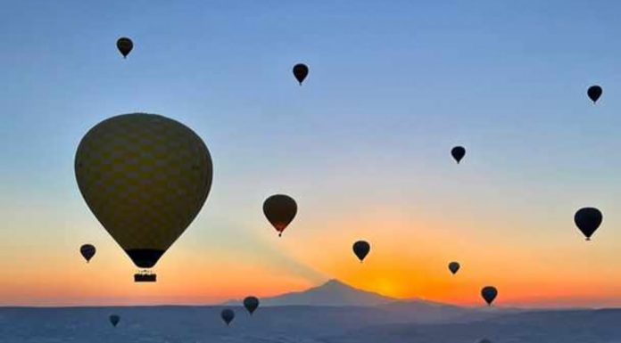 Hot air Balooning in Cappadocia, Turkey at Sunrise.Hot air ballooning over Cappadocia, Turkey at sunrise is widely considered one of the premier travel experiences in the world. Dozens of colorful balloons lift off simultaneously, floating above fairy chimneys, volcanic rock formations, and valleys illuminated by dawn light.#travel #hotairbaloon #cappadocia #turkeytravel #travelpics