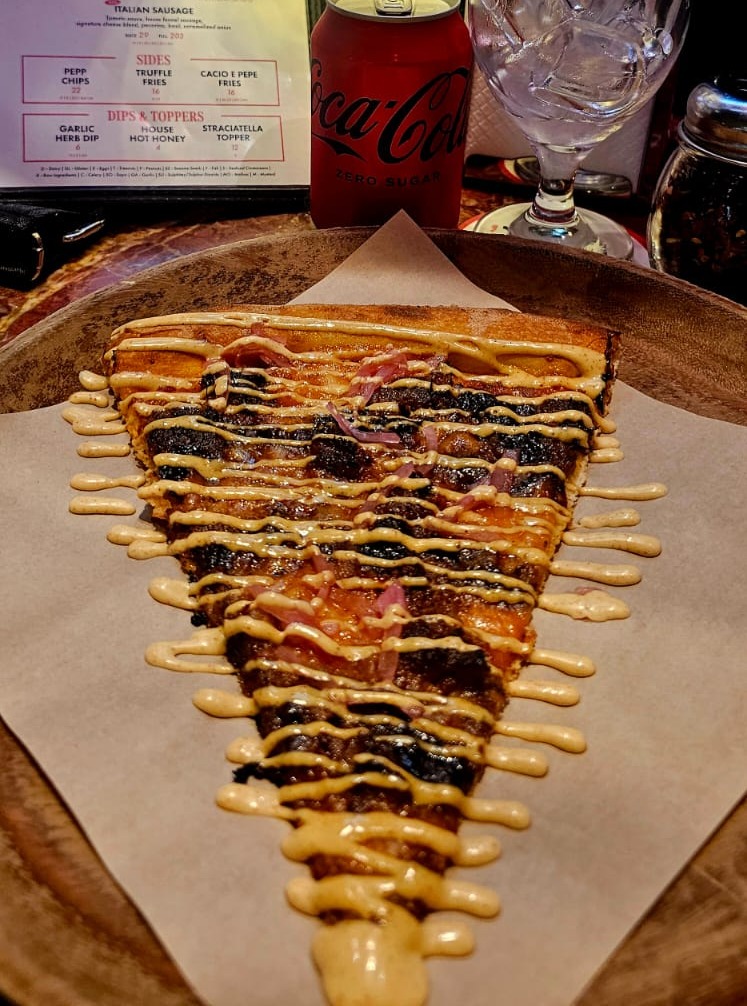 Alabama Smoke Pizza at 'ZA 'ZA pizza by the slice.‘Za ‘Za Slice is a popular New York-style pizza slice bar with multiple locations in the United Arab Emirates (Dubai and Abu Dhabi)@zazaslice For more places to eat check out our restaurant directory www.simplysublime.co.za #pizzaindubai #dubaitravel #dubaifood #zazaslice #newyorkstylepizza